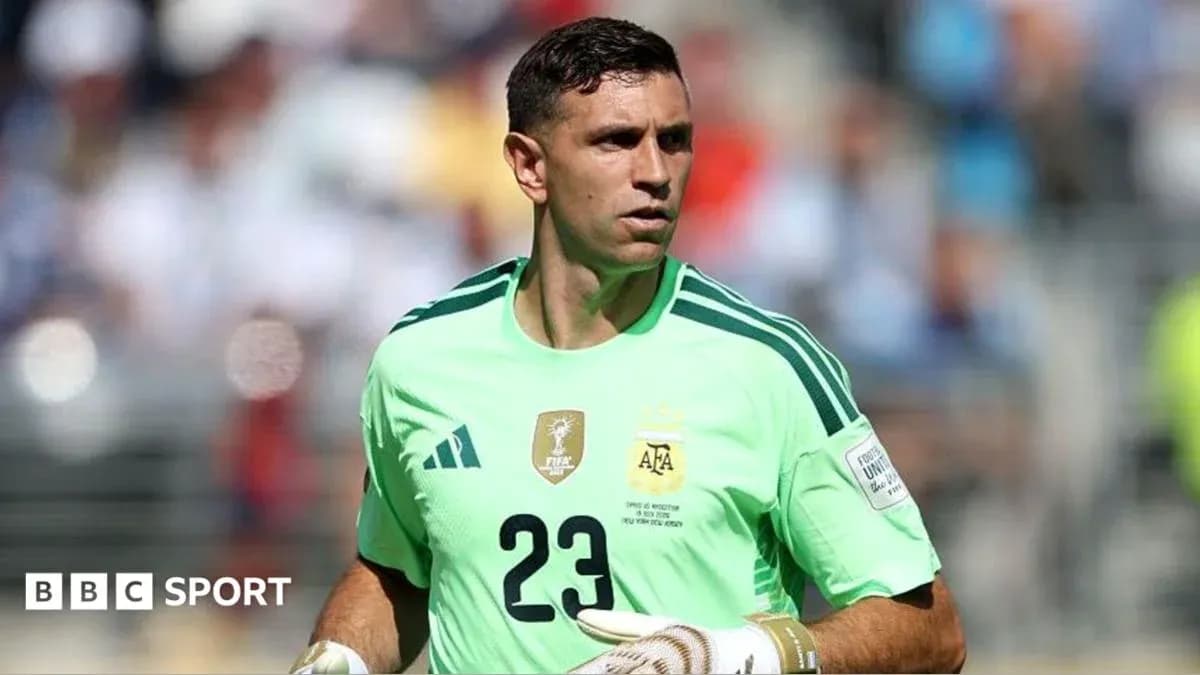 Goalkeeper wearing green jersey during match warm-up