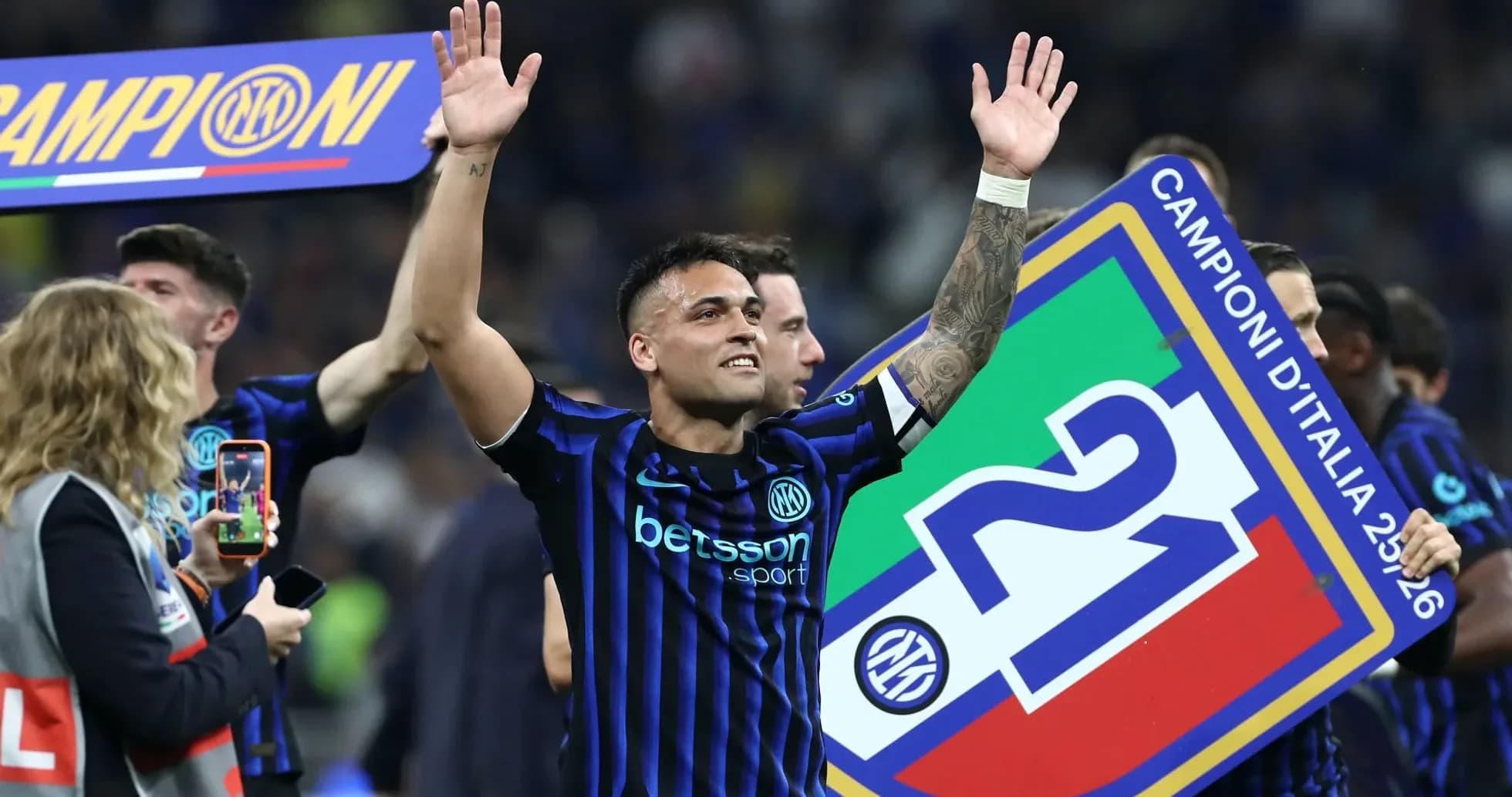 Player celebrating with championship banner after match