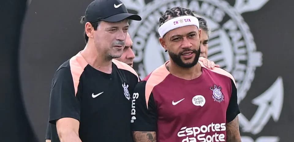Coach and player discussing during training session