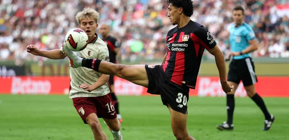 Player kicking ball during match action