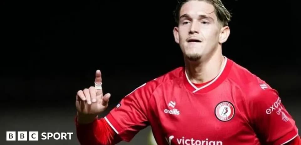 Player celebrating a goal wearing red jersey