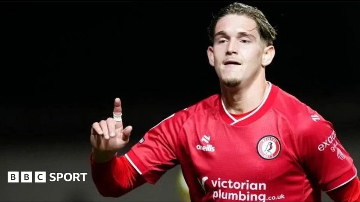 Player celebrating a goal wearing red jersey
