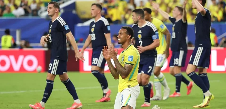 Brazilian player on knees during match against Scotland