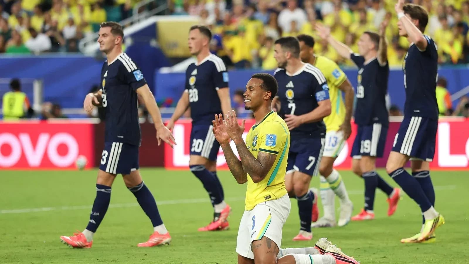 Brazilian player on knees during match against Scotland