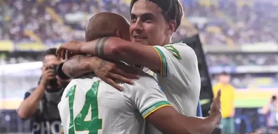 Two players embracing after a match celebration