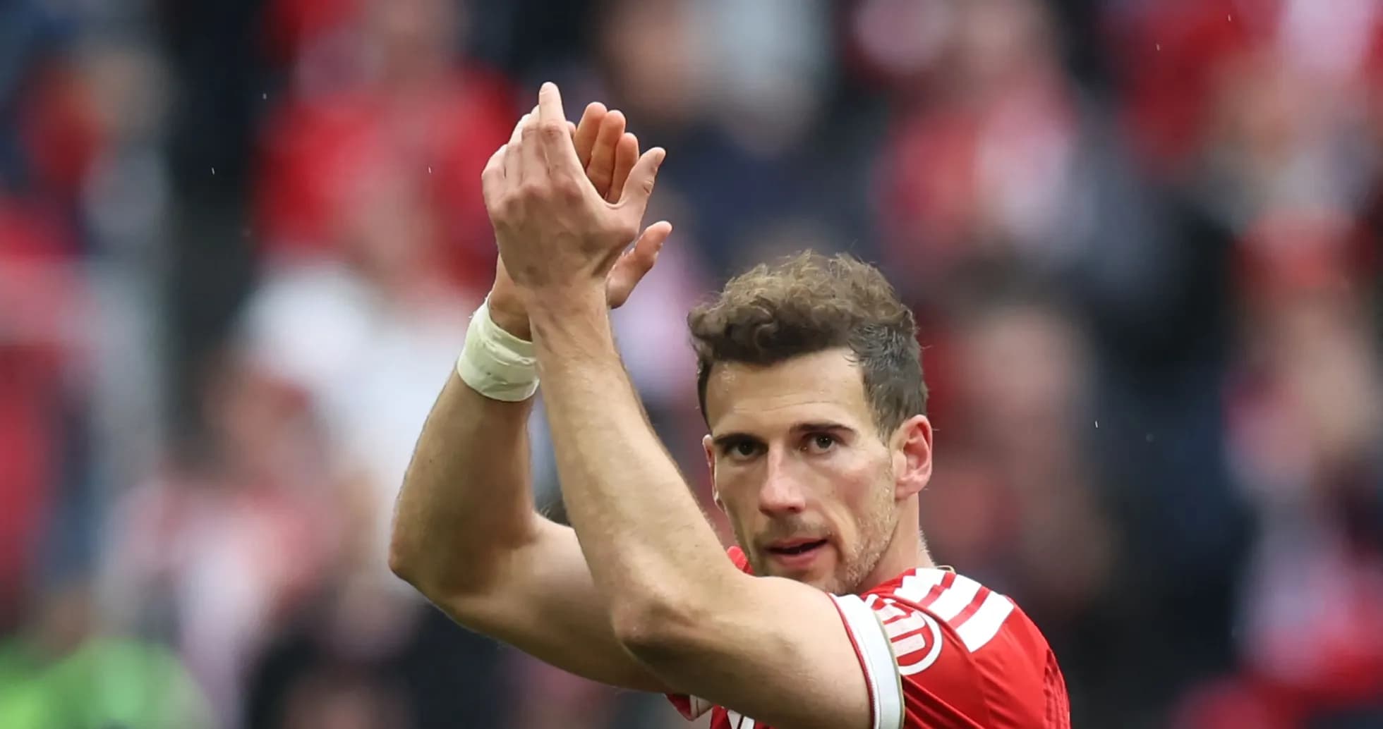 Player applauding fans after match conclusion