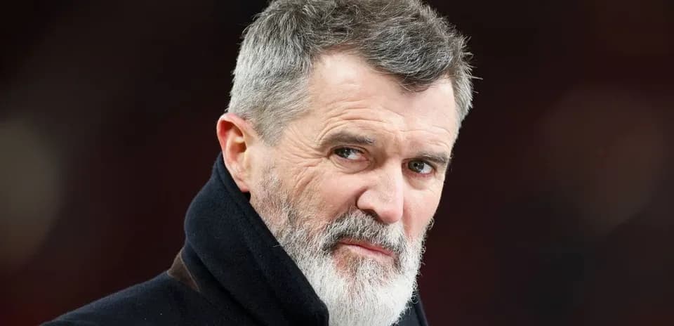 Man with gray beard looking directly at camera