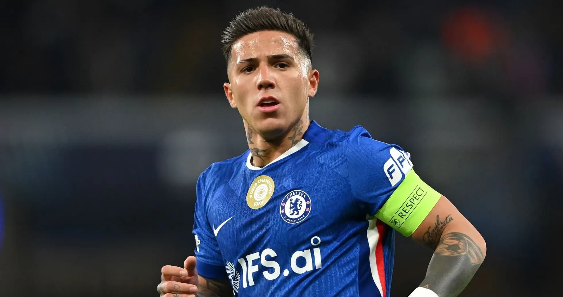 Player in blue Chelsea kit with captain's armband