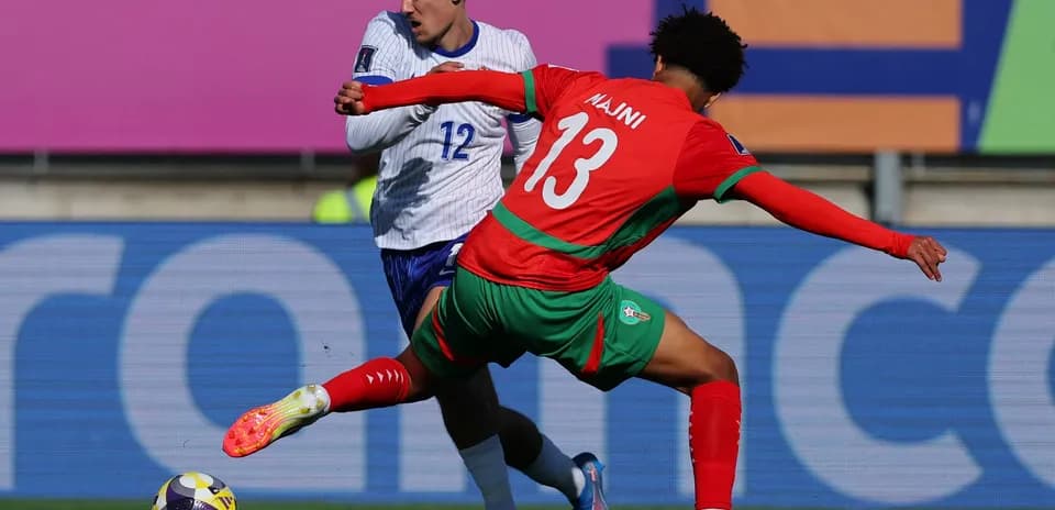 Player tackling opponent during football match action