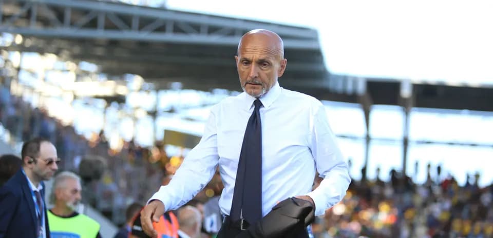 Coach walking on the sidelines during a match