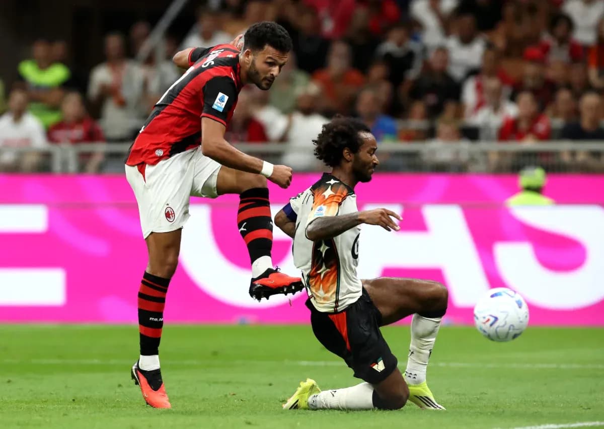 AC Milan player kicking ball during match