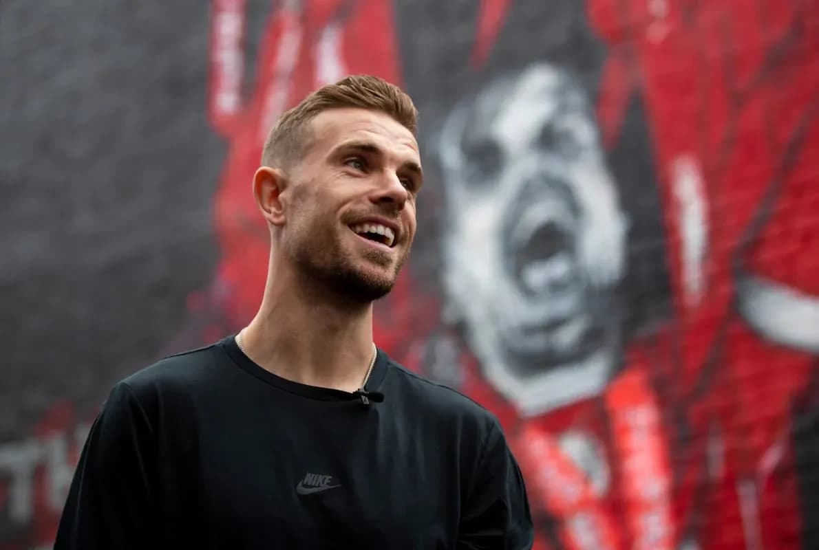 Player smiling in front of mural backdrop