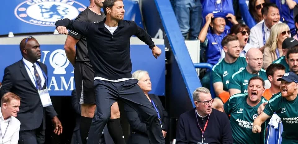 Manager celebrating near the sidelines during match