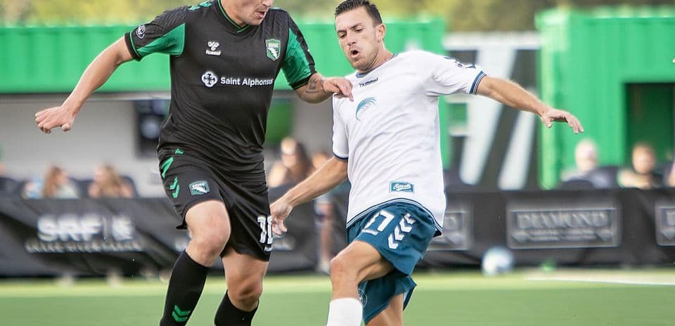 Player tackling opponent during Spokane Velocity match