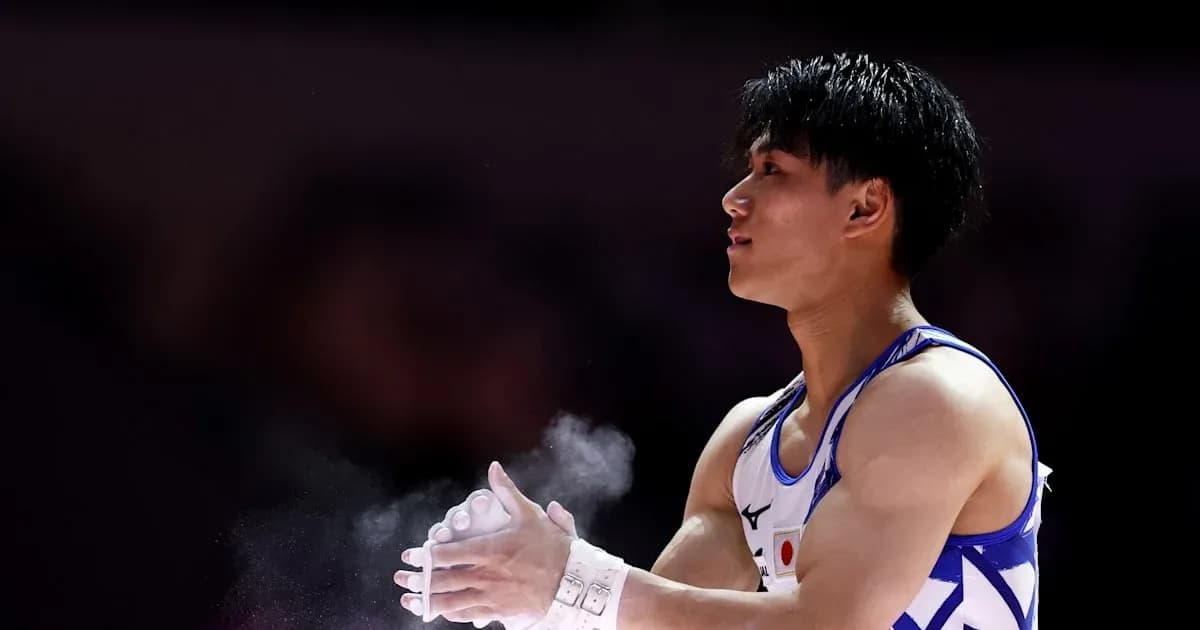 Gymnast preparing with chalk before routine
