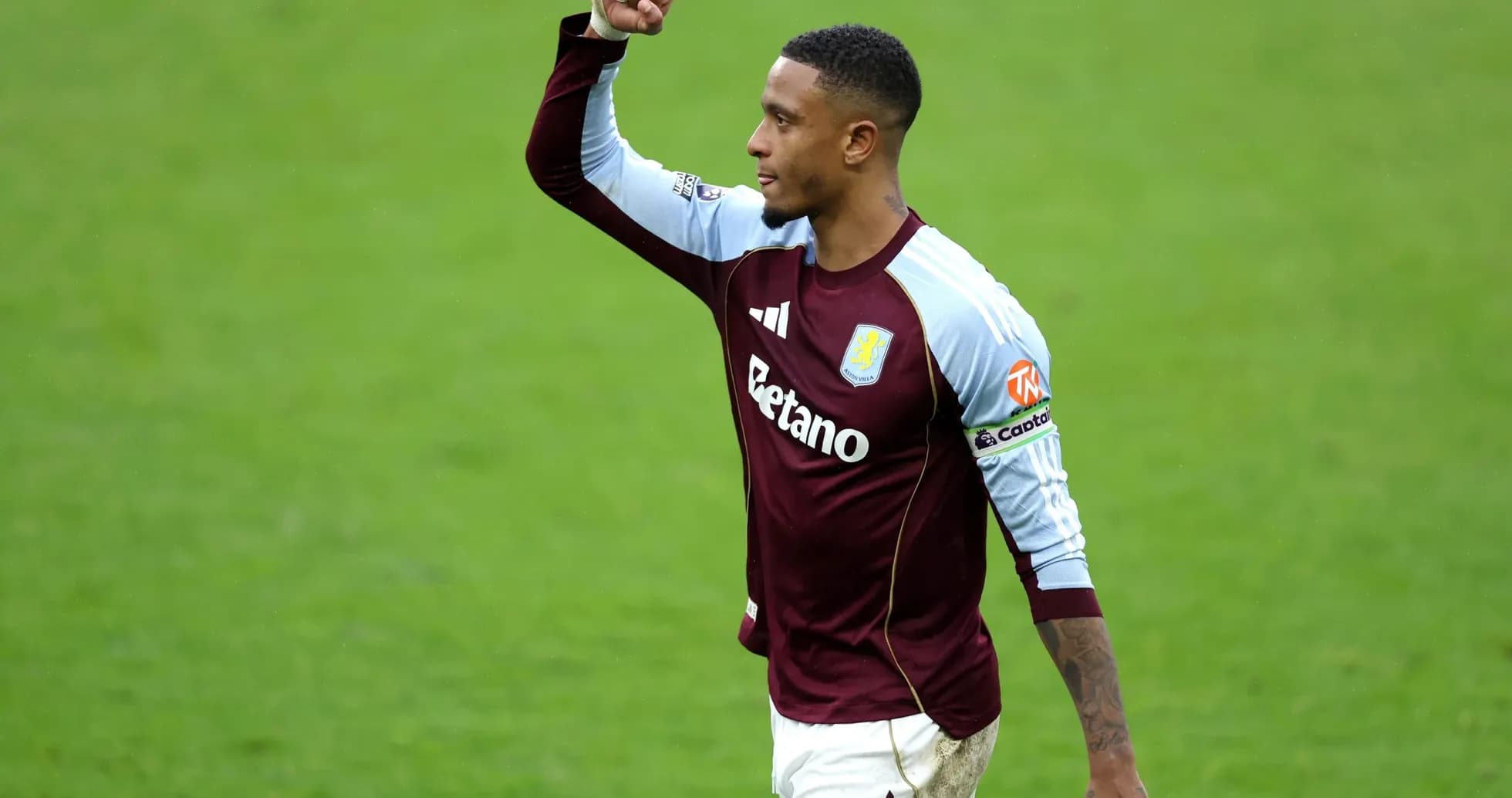 Aston Villa player celebrating on the pitch