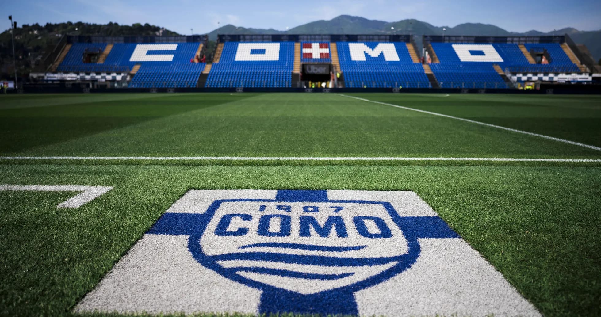 Como stadium with team logo on the field