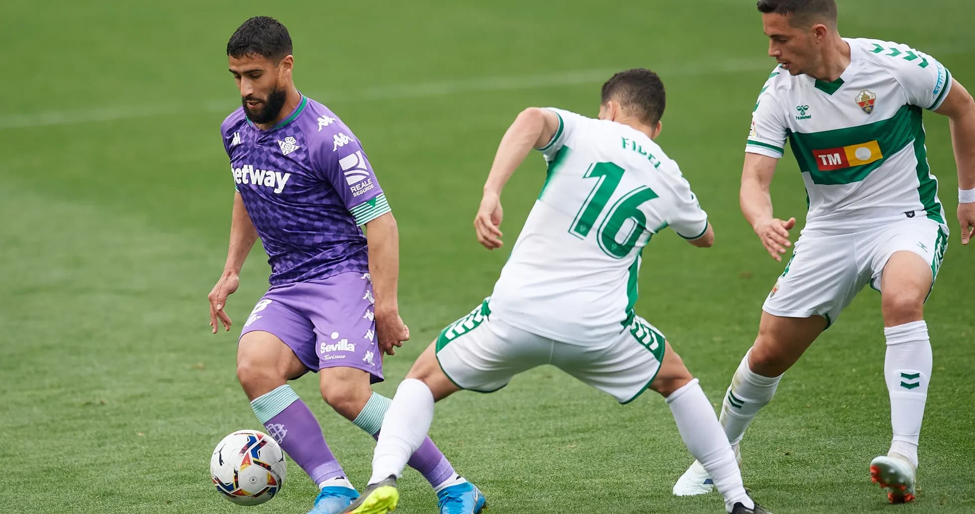 Real Betis players competing against Elche