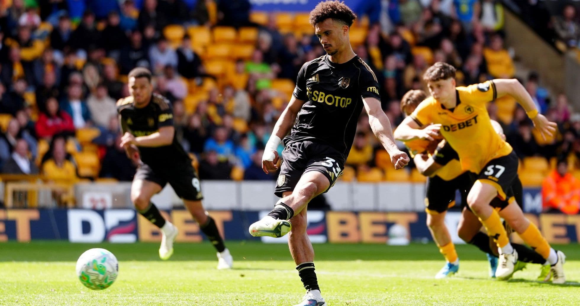 Wolverhampton player taking a penalty kick