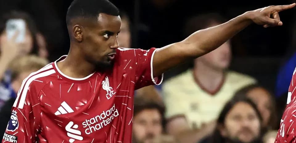 Liverpool player directing teammates during match