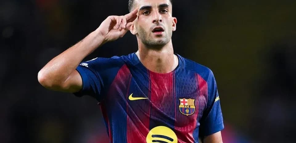 Player saluting during match wearing FC Barcelona jersey