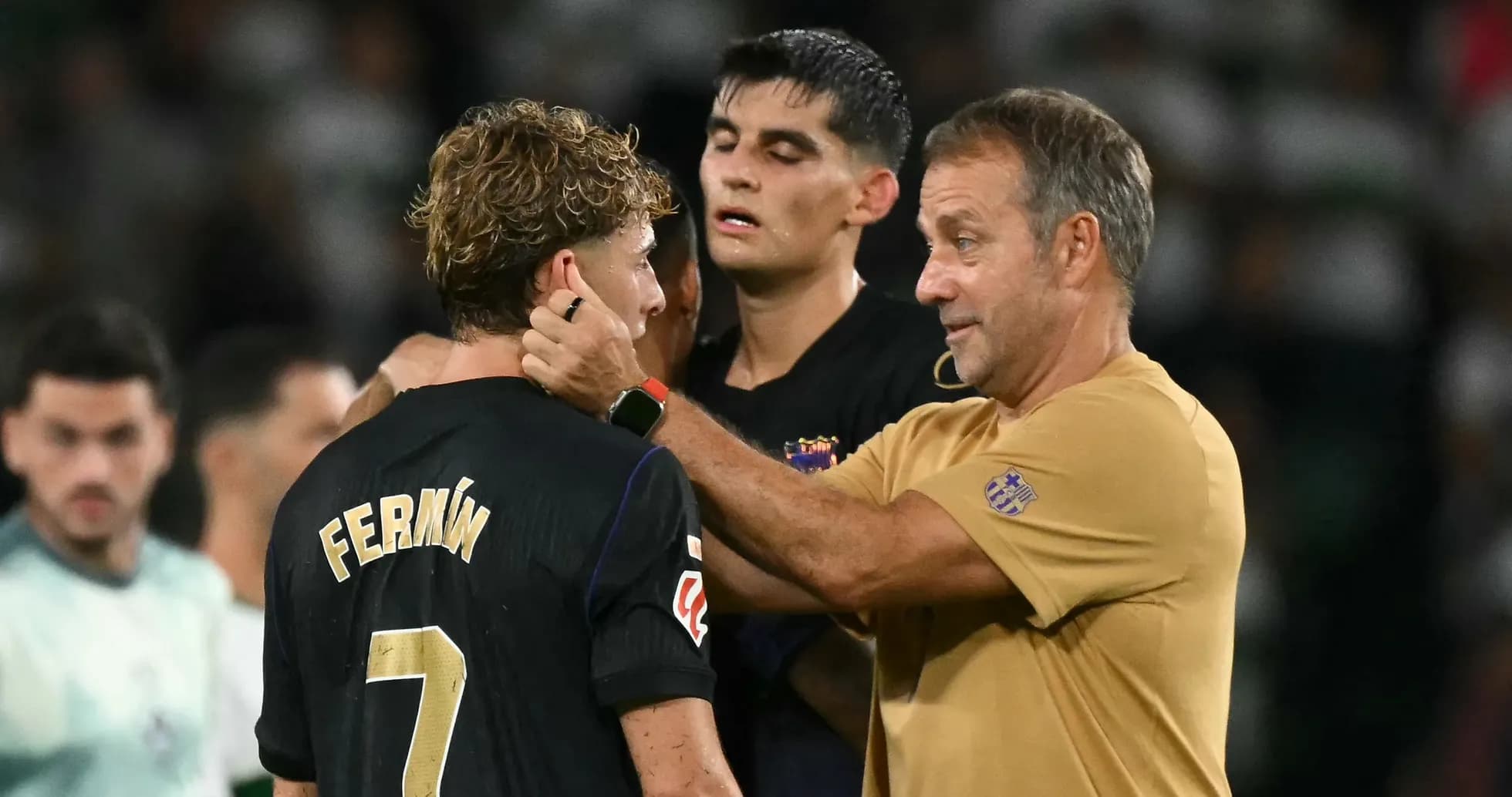 Coach talking to player Fermín after match