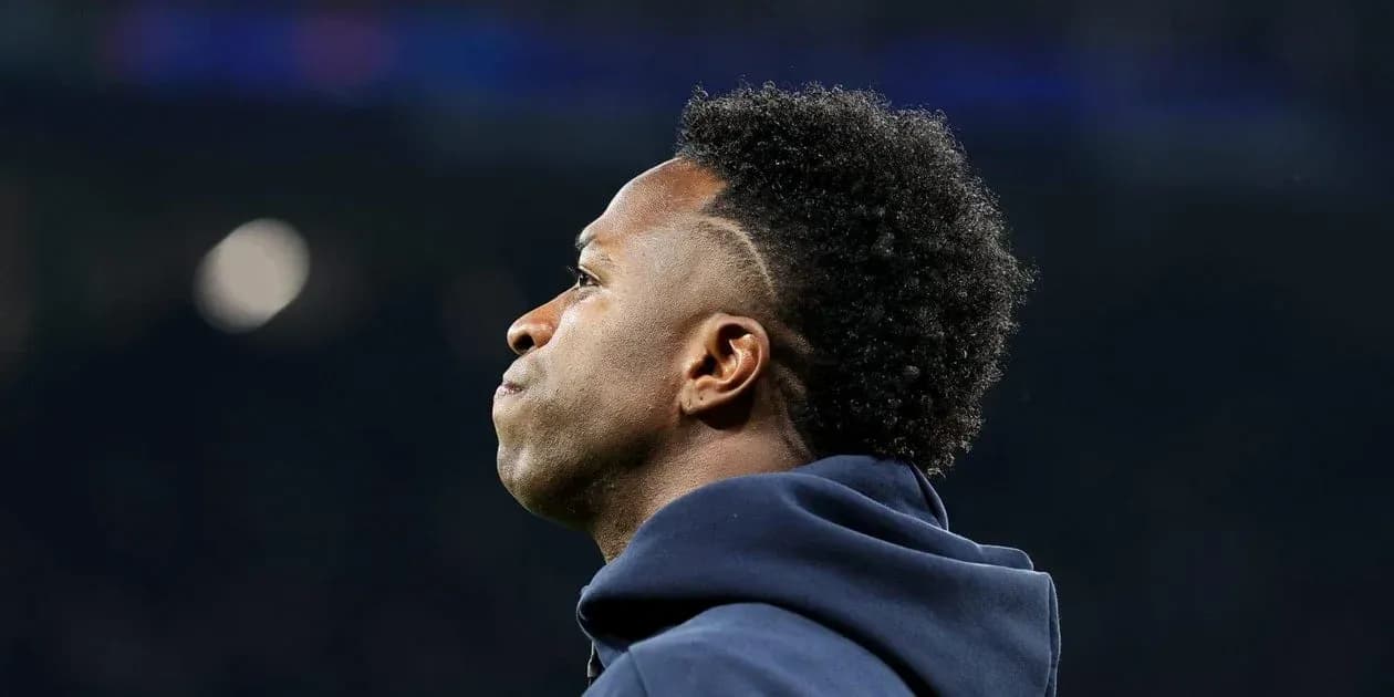 Player in hoodie looking away from the camera