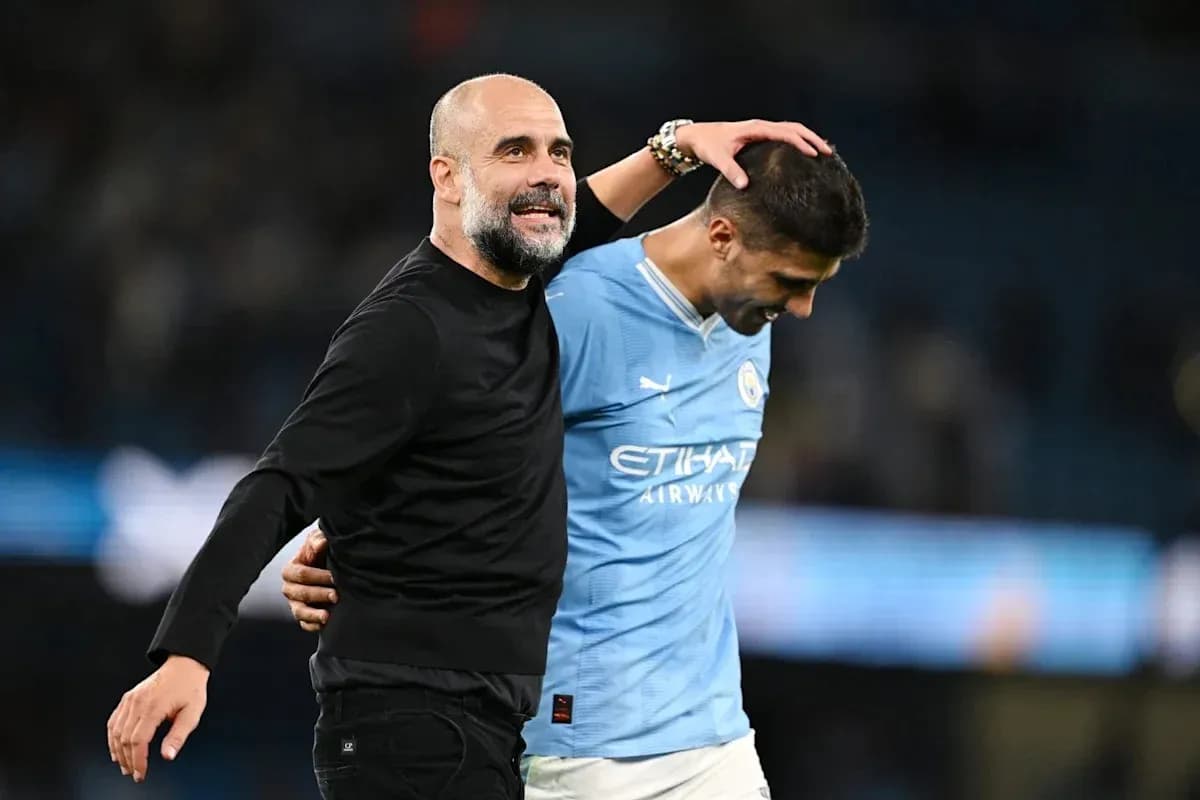 Manager and player celebrating after match victory