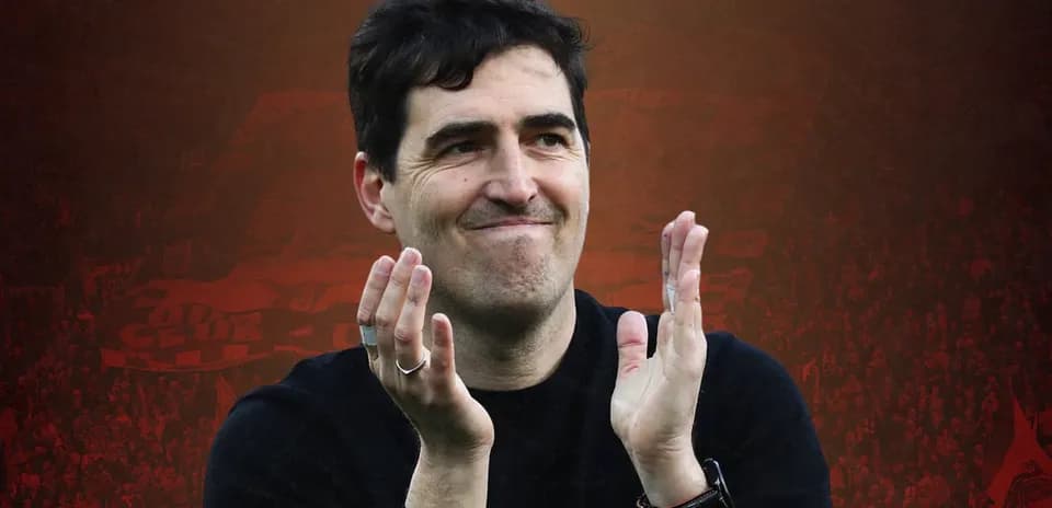 Coach applauding fans during a match celebration