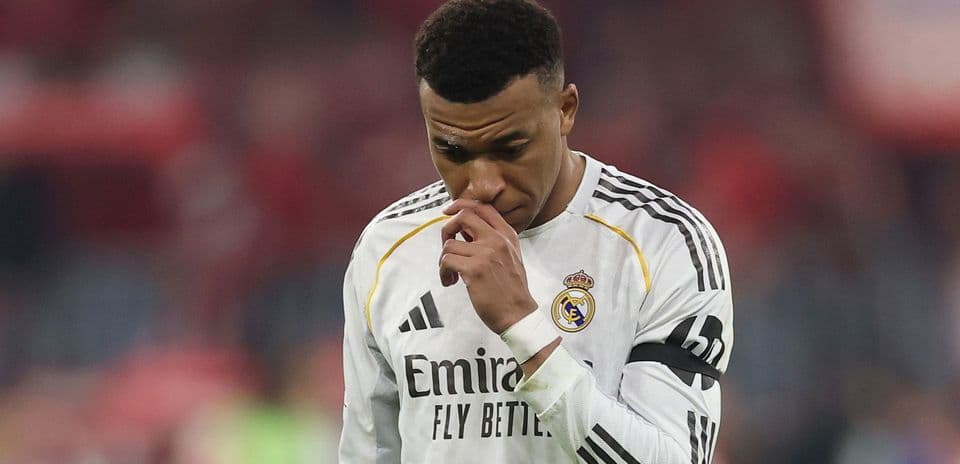 Player in Real Madrid jersey looking down