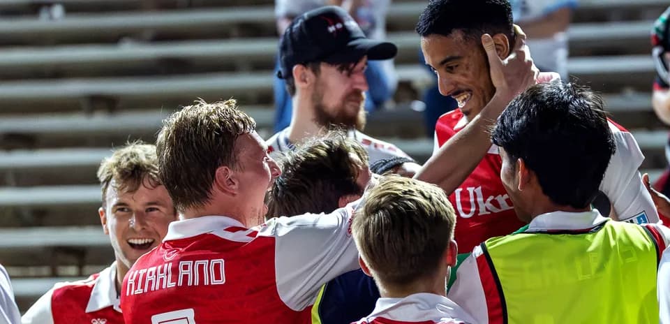 Players celebrating a goal during match
