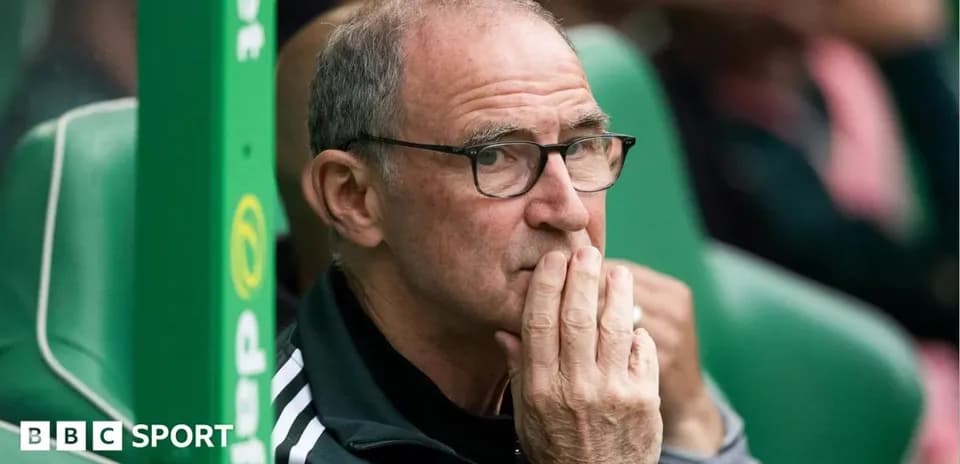 Coach observing from the sidelines during a match