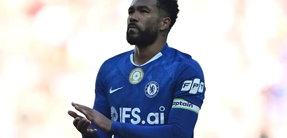 Player in blue jersey clapping on the field