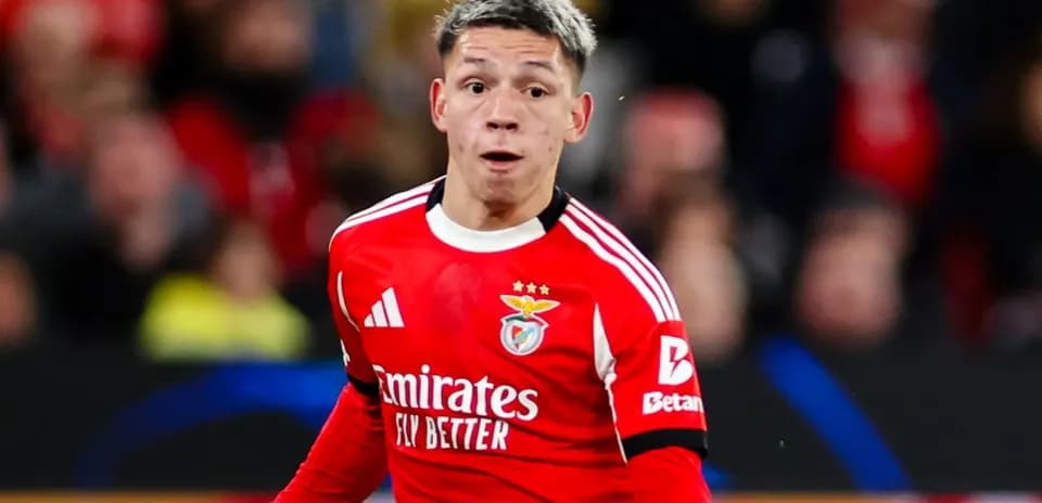 Player in red Benfica kit during match action
