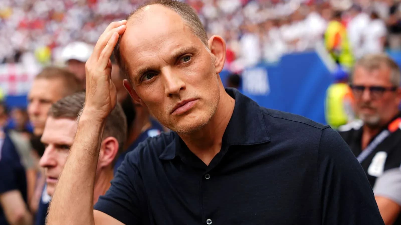 Coach observing the match from the sidelines