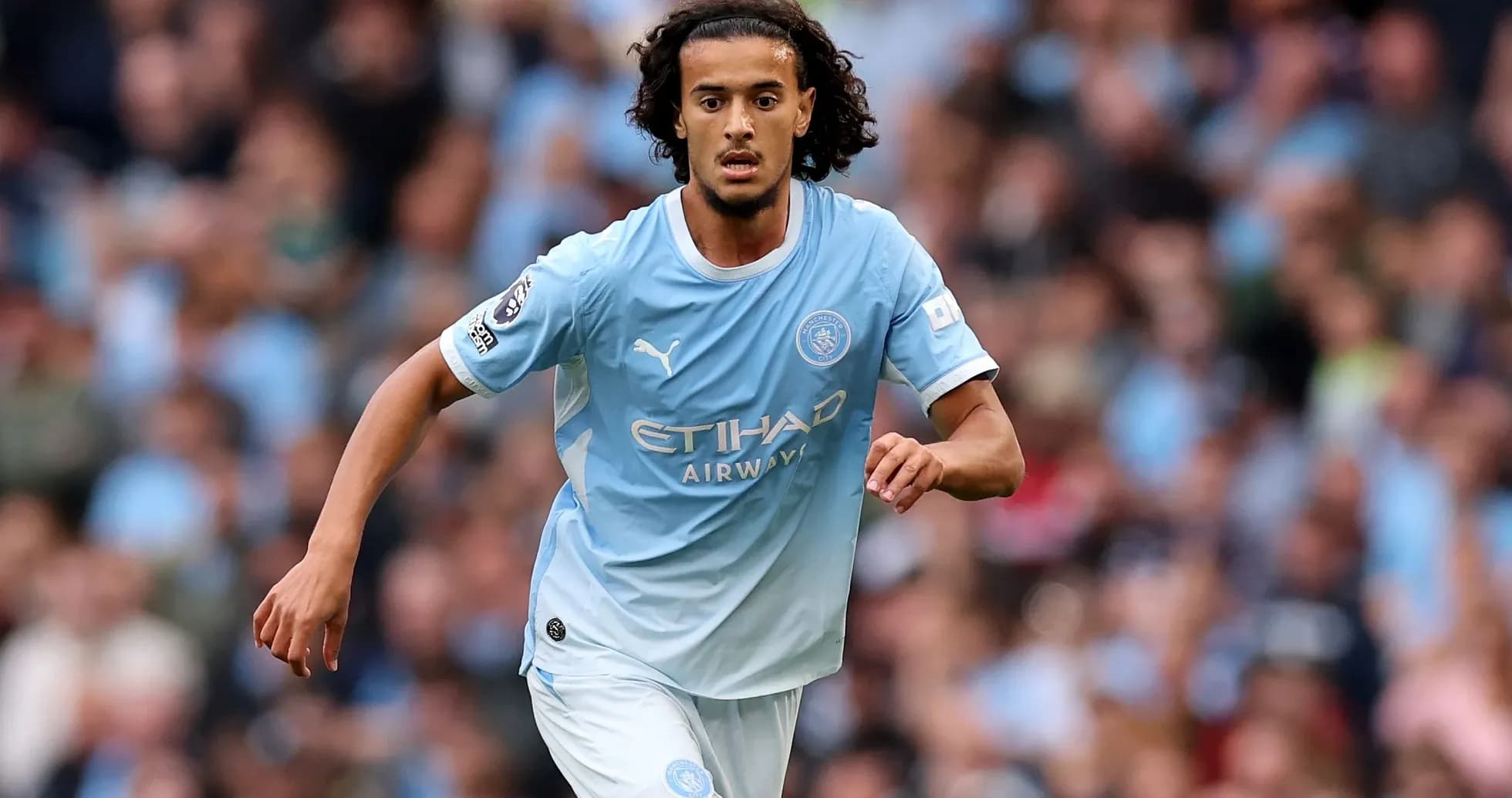 Player running during a Manchester City match