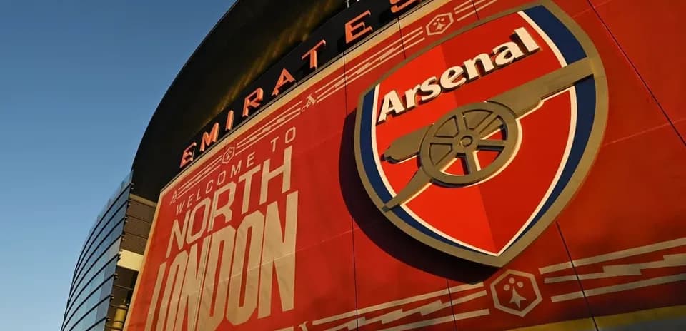 Emirates Stadium exterior with Arsenal logo displayed