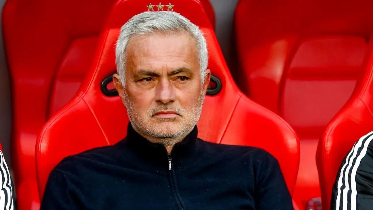 Manager sitting on bench during match