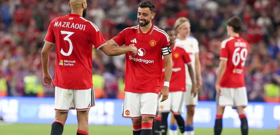 Bruno Fernandes and Mazraoui celebrating on the pitch
