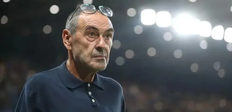 Coach observing match from the sidelines