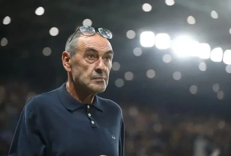 Coach observing match from the sidelines