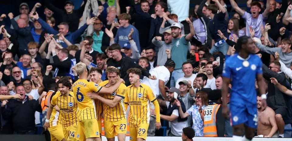 Brighton players celebrating goal with fans