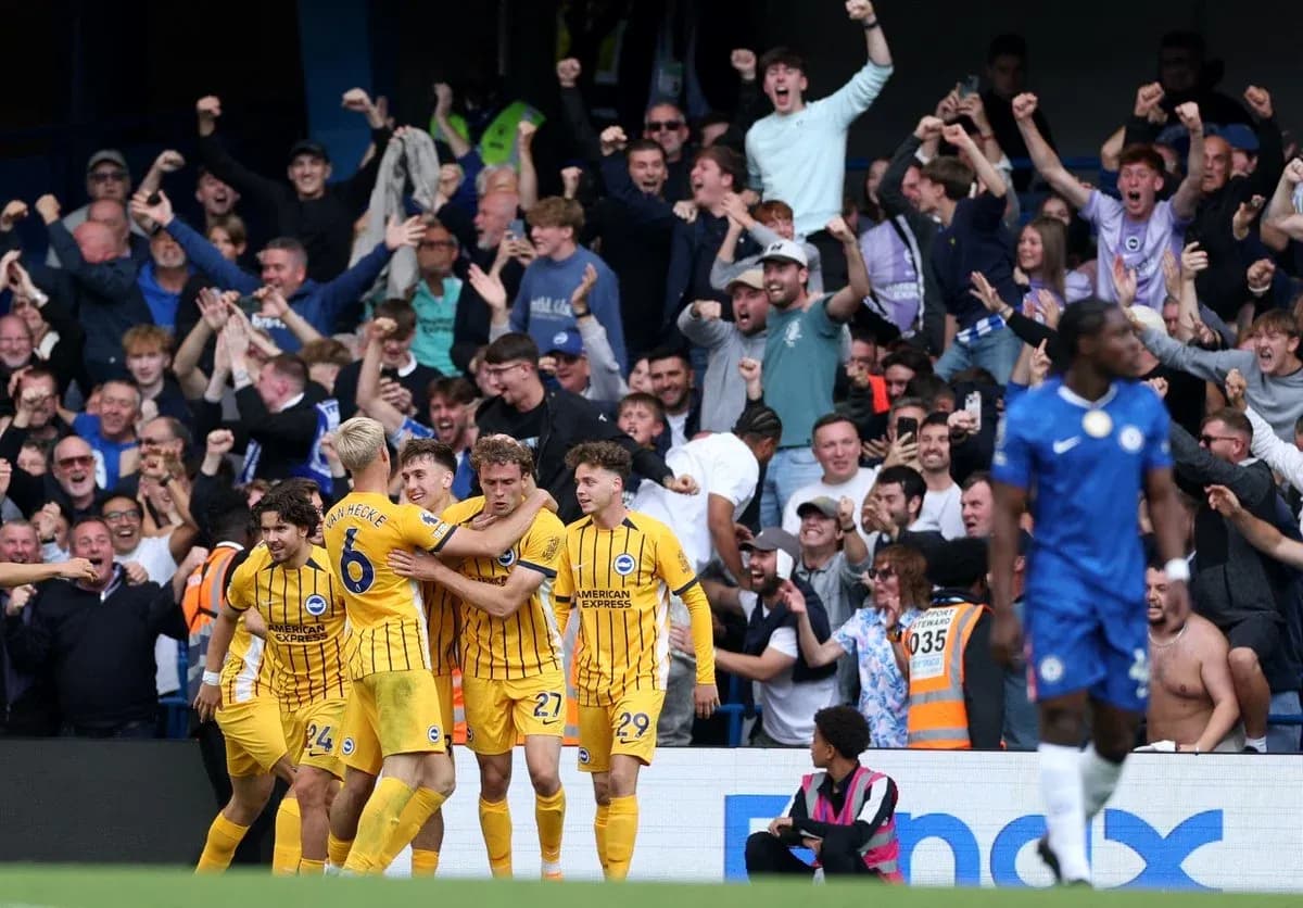 Brighton players celebrating goal with fans