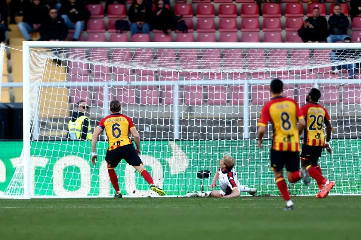 Goalkeeper being challenged during Lecce vs Genoa match
