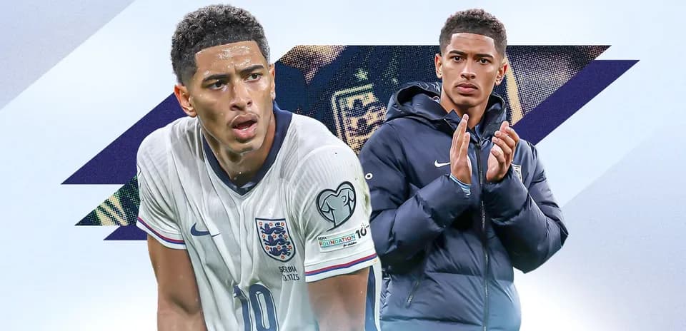 Player in England kit and teammate applauding