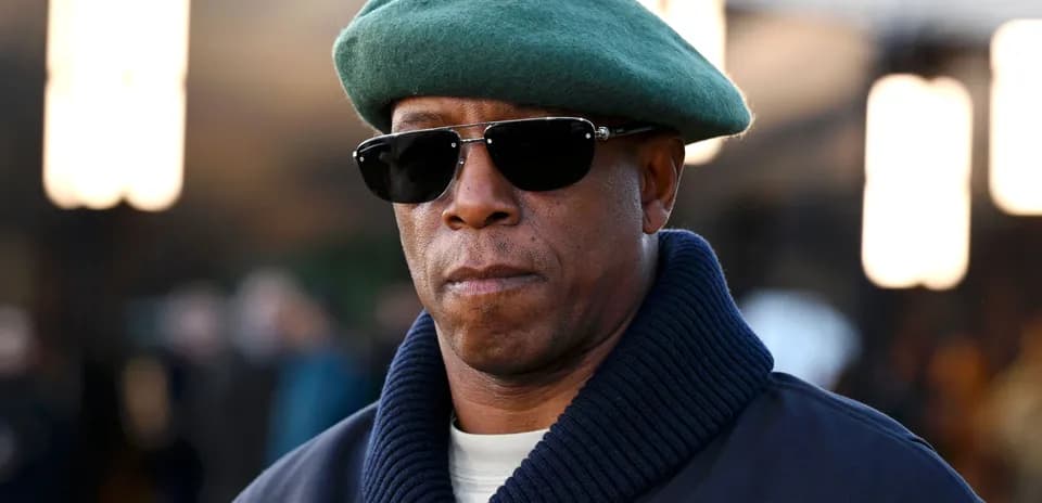 Man wearing a green beret and sunglasses