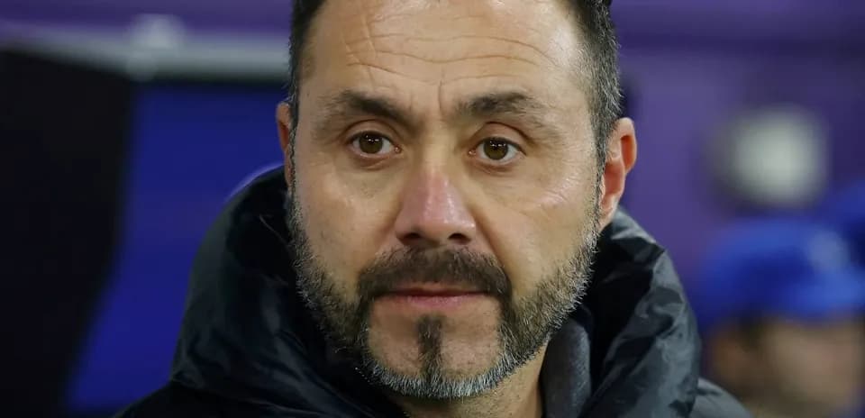 Coach observing from the sidelines during a match