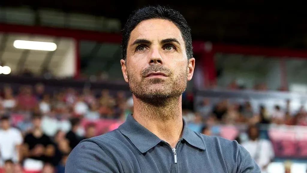 Manager observing from the sidelines during match
