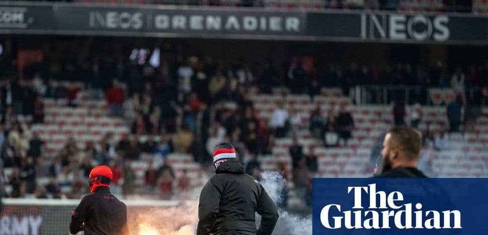Fans setting off flares in stadium stands