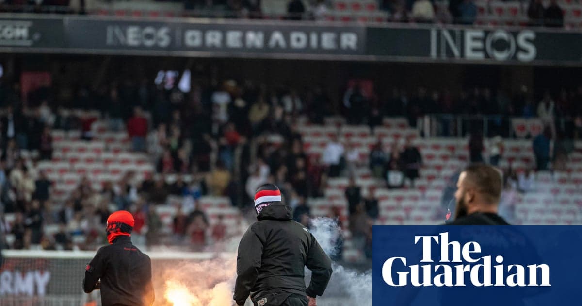 Fans setting off flares in stadium stands